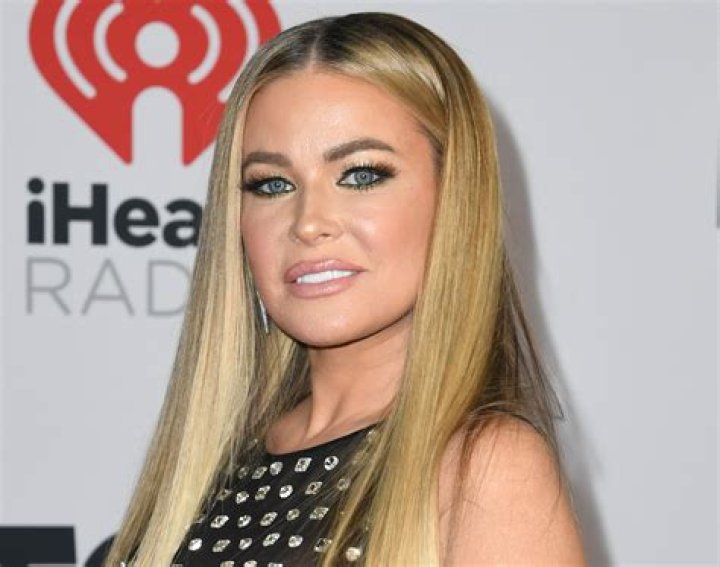 Carmen Electra in Bathing Suit Says "Secret is Out" — Celebwell